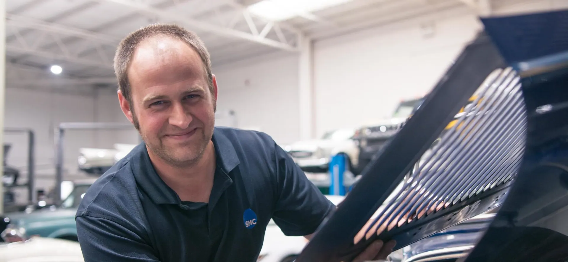 Experienced technician working on a classic car