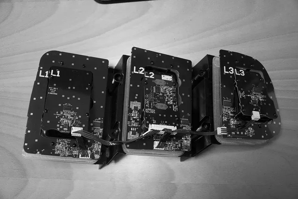 Three sections of a 2013 GT500 rear light with the circuit boards exposed