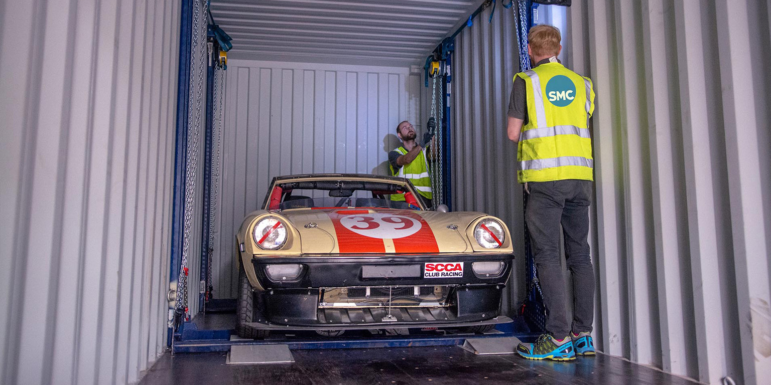 Car shipping to the UK. Photo of car being loaded into container for import to or export from the UK